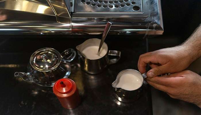 A man preparing coffee.