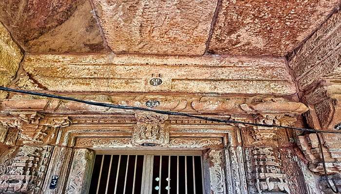 The intricately carved pillars depict detailed artwork.