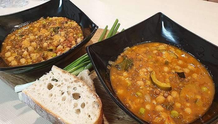 Ribollita, a traditional soup served in a bowl with bread prepared with vegetables and beans.