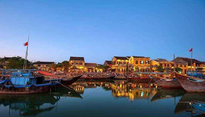 Enchanting night boat ride in Hoi An, Vietnam, with vibrant lanterns and lively atmosphere of Hoi An Night Market.