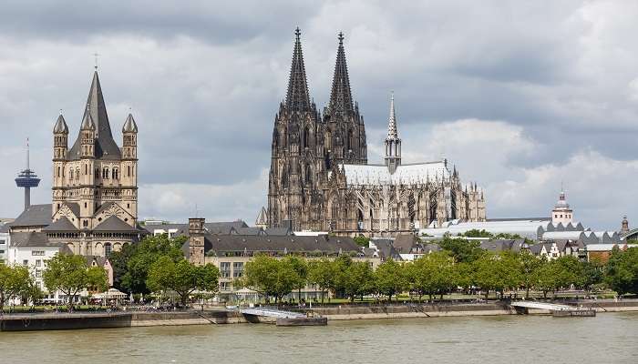 A captivating view of Cologne Cathedral's towering spires against a clear sky 