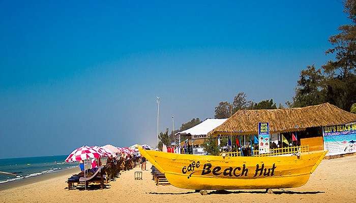 Boat and sunbathing chair at Baga Beach in Goa