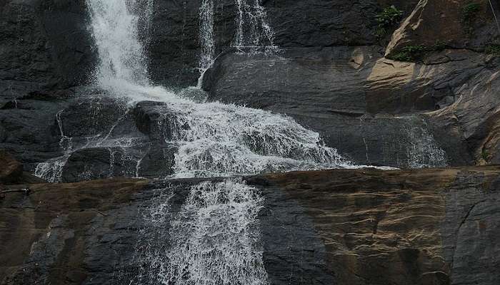 Water cascading down the rugged terrain