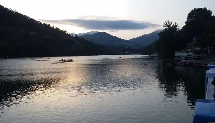 Serene view of Bhimtal Lake surrounded by mountains, one of the best places to visit in Bhowali.