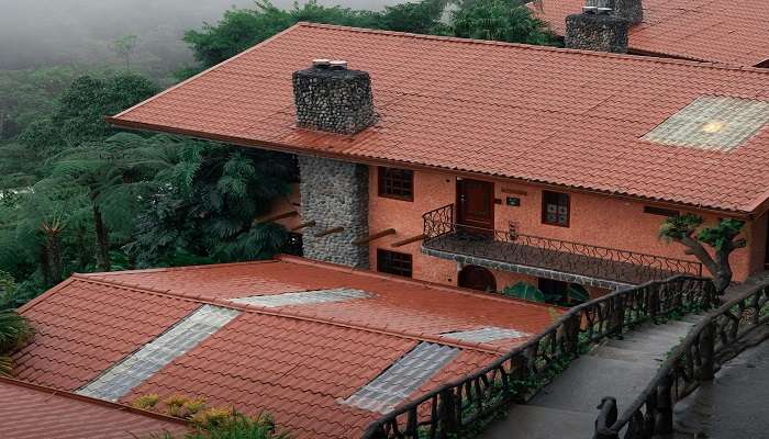 The red rooftop and the valley in the background of the Cafe Buransh in Sari Village.