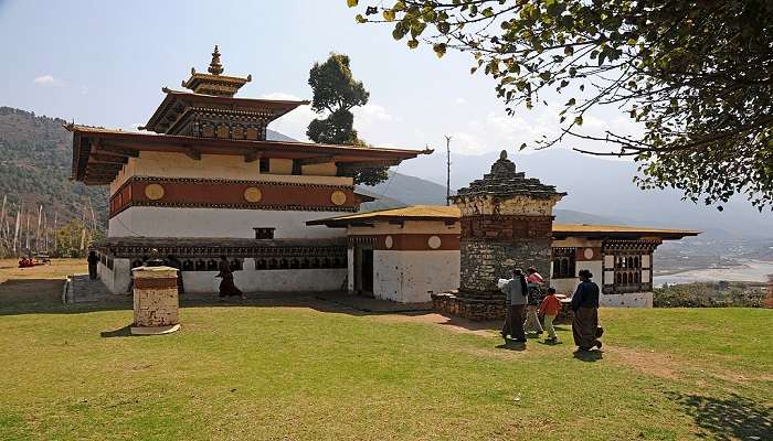 The temple of Chimi Lhakhang in green landscape