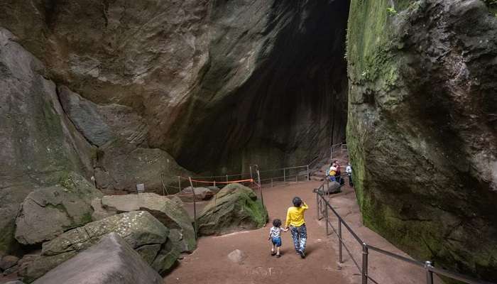 Tourists exploring Edakkal caves.