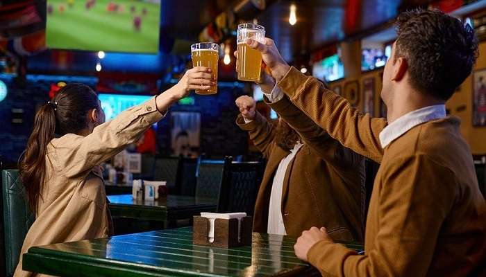 A group of friends having beer and watching sports at one of the best Pubs in Devonport 