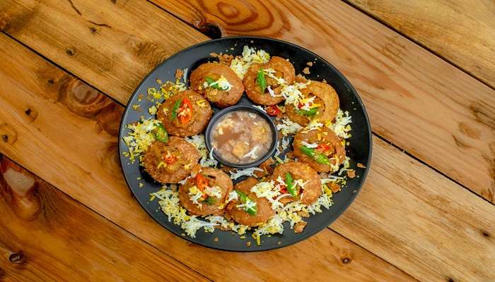 Deep-fried bread pani puri with chickpea filling served at Farzi Cafe, a popular spot among Cubbon Park Restaurants