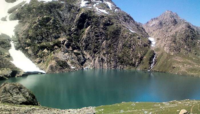 Gadsar Lake with wildflowers in bloom.