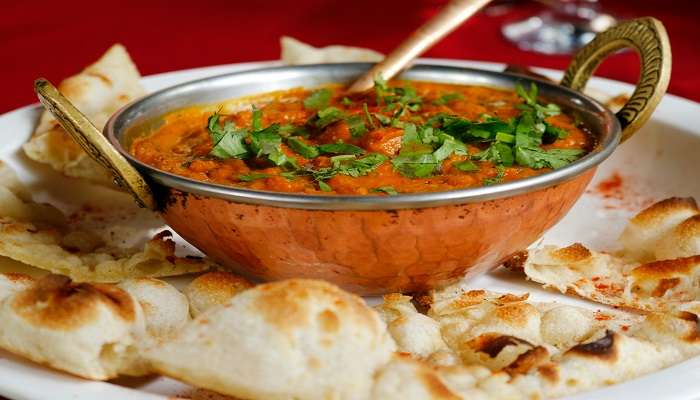 Indian bread with rich creamy curry, a must-try snack.