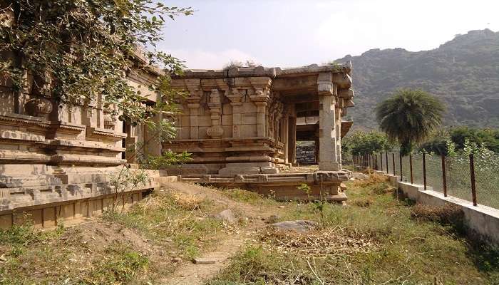 Scenic view of Kondaveedu Fort's ancient ruins against a backdrop of lush greenery. 