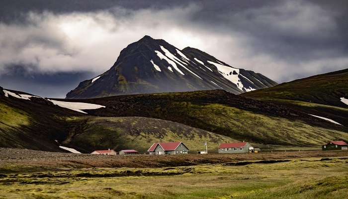 A picturesque view of Machil, showcasing its verdant meadows, snow-capped mountains