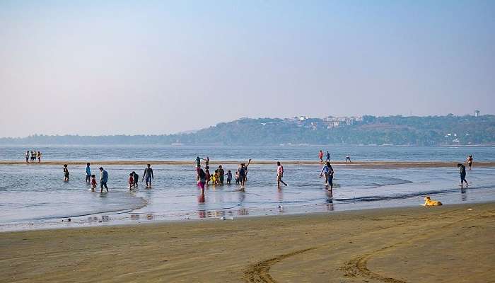 Tranquil view of Miramar Beach with its characteristic red cliffs.