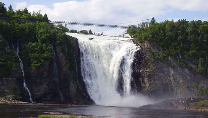 Explore the Montmorency falls in the Quebec winter carnival.