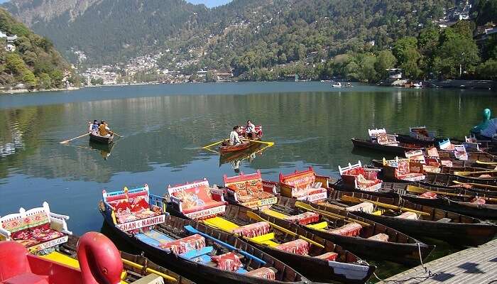 Naini Lake of Nainital bustles amidst hills and colourfully done-up markets.