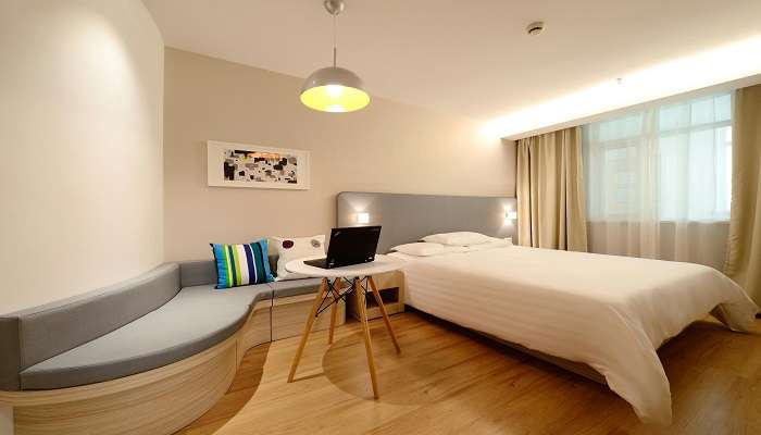 The view of a double bed in a hotel, Hotels near Sarafa Bazaar