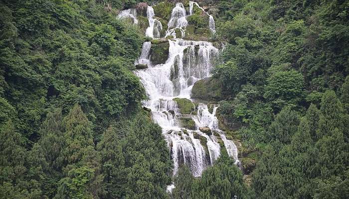 The serene Shankar waterfall positioned near Nargol Beach Gujarat