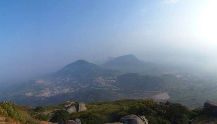 Night trekking trail to Skandagiri; silhouetted hill under the starry sky—beats a punishing climb by Devanahalli Fort