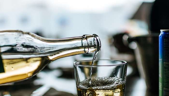 White wine being poured into a glass 