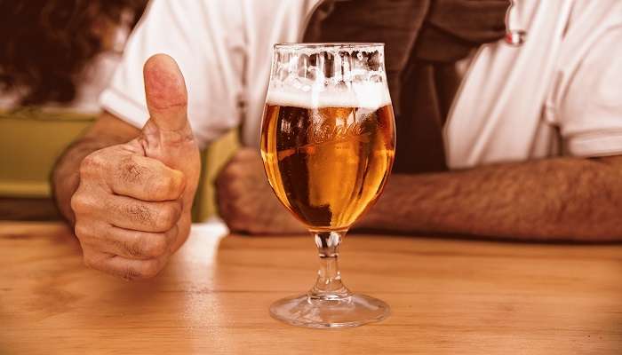 man enjoying his glass of beer