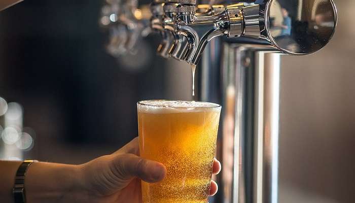 In-house brewed beer in a tall glass