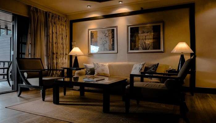 A hotel room with a lighted table room