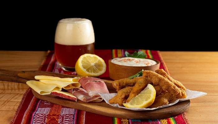 fried chicken tenders with a side of craft beer