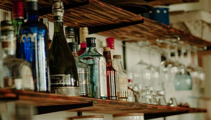 A photo of bottles on the shelf