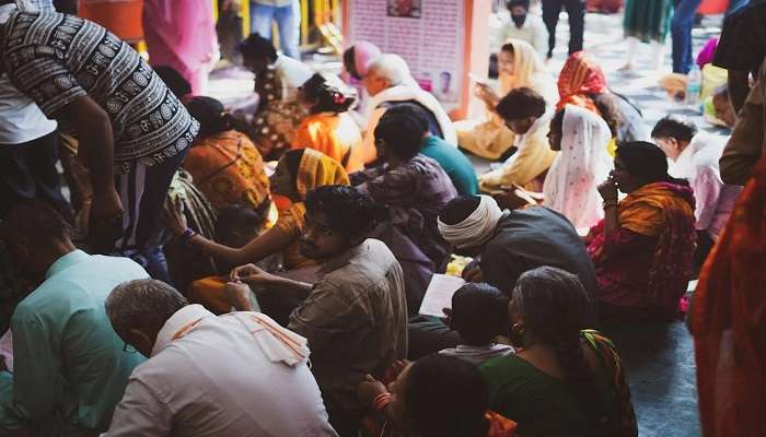 Devotees offering prayers during Tulasi Puja.