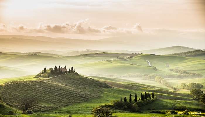 The Val d'Orcia is quintessential Tuscany, with its rolling hills, cypress-lined roads, and medieval villages., places to visit in tuscany