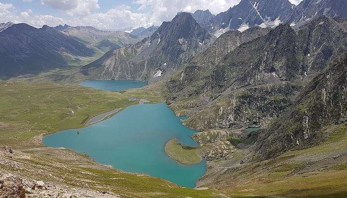 Vishansar Lake is established in towering snow-white mountains.