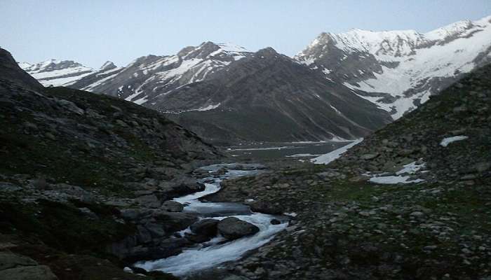 Sheshnag Lake, a serene high-altitude lake nestled amidst mountains in Kashmir.