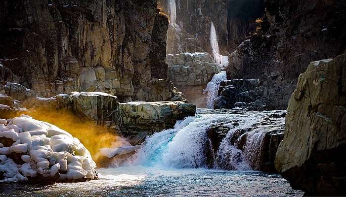 A stunning view of the Aharbal Waterfall in Sedow