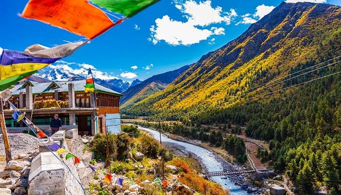 View of Chitkul Village with the river flowing alongside 