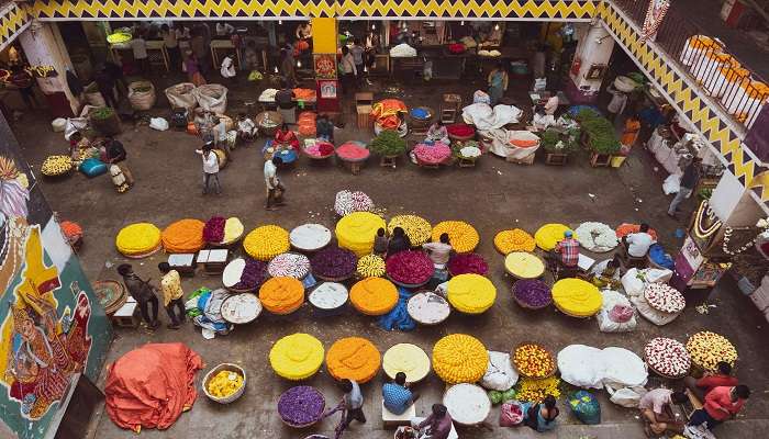 woman selling traditional jewellery at local market.