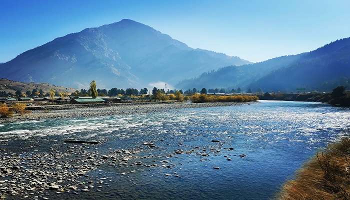 Gurez Valley with the flow of Kishenganga River through a lush green meadow 