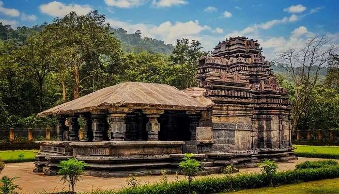 Temple surrounded by beautiful gardens near the Tambdi Surla Waterfall.