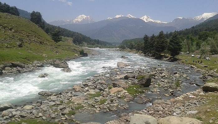 Image of people rafting at Lidder river near the Sheshang lake.