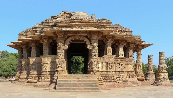 Visit the Sun Temple in Modhera known for its intricate stone sculptures, near Gujarat Rani Ki Vav