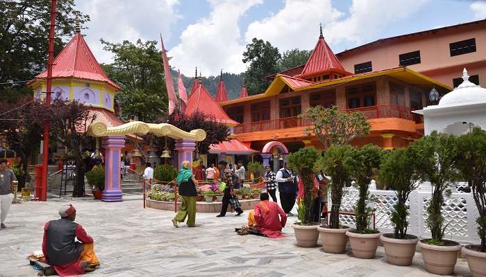 Devotees are at the stained bright gate of the famous Naina Devi Temple at Nainital.