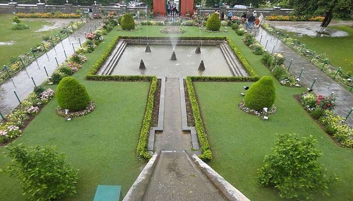 Terraced lawns with beddings of flowers, fountains, Nishat Bagh, views of Dal Lake and mountains near the Hazratbal Masjid