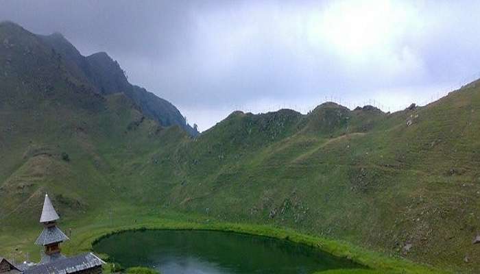 Scenic Prashar Lake with the pagoda-like temple on its bank