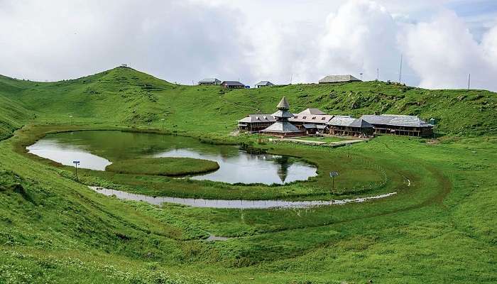 Scenic Prashar Lake with the pagoda-like temple on its bank