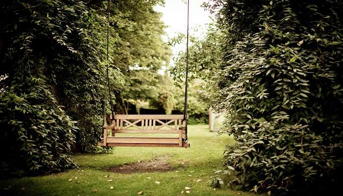 Lush green gardens with well-maintained pathways.