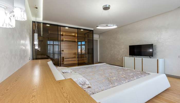 A modern interior with a king sized bed room. 