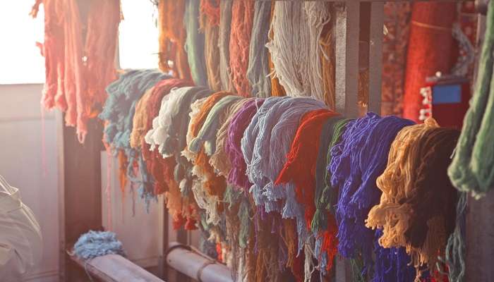 Feel rich textiles flow through your hands at Al Fahidi Historical Neighbourhood 