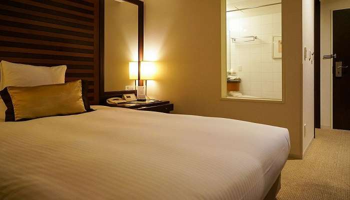 A comfy bedroom at the top Hotels in Adambakkam.