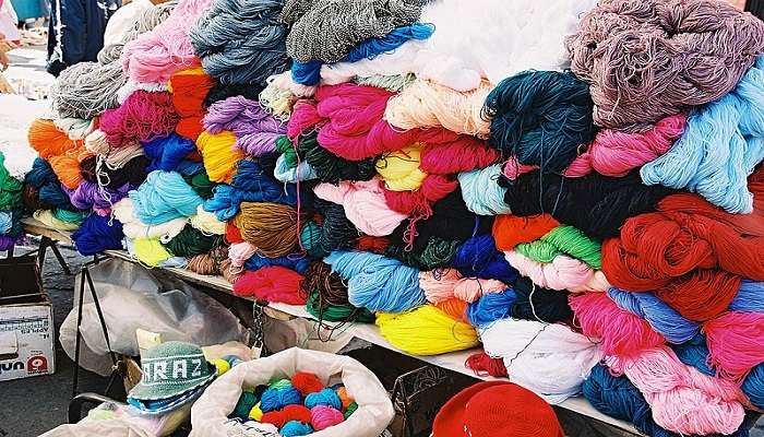 Colourful handmade woollen socks at a street market in Nainital.