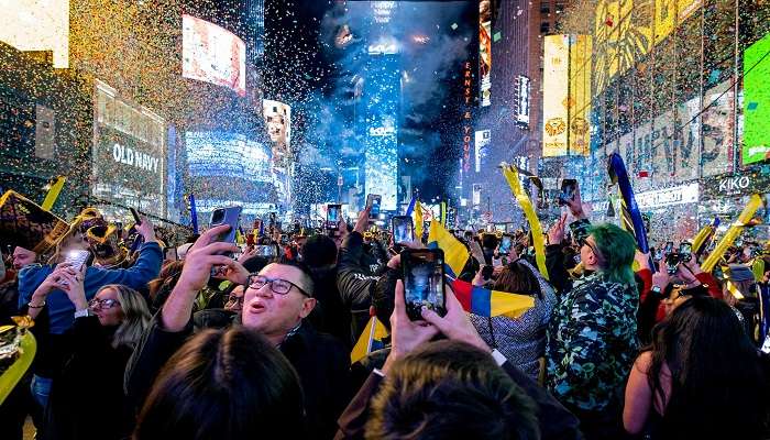 People capturing moments at New Year parties in New York